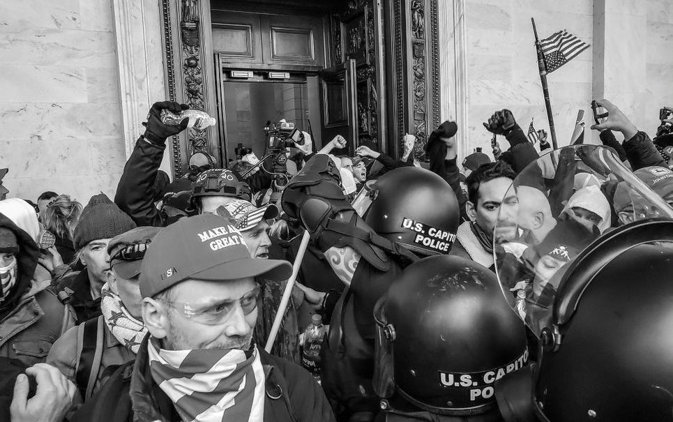 Rioters storming the Capitol.