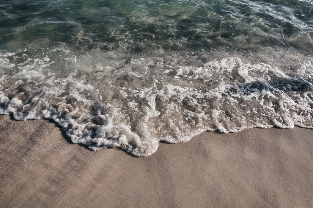 Waves meeting the sand.