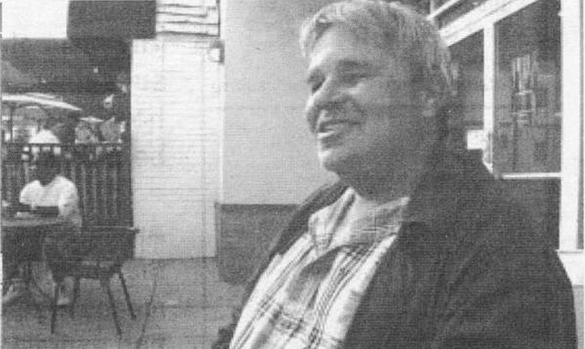 A photo of a man smiling.