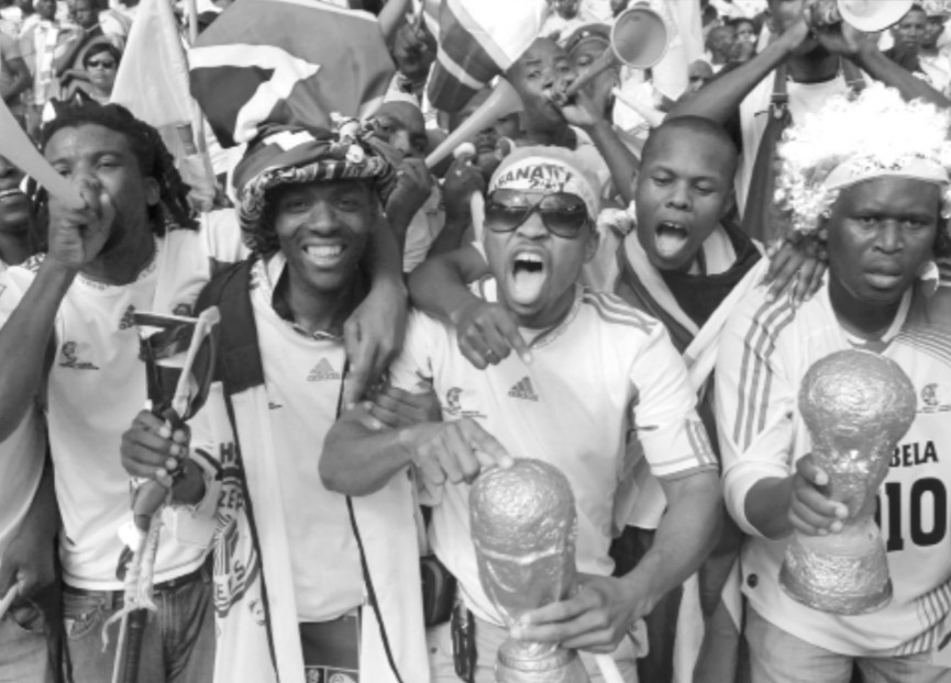 Photo of South African soccer fans cheering before a World Cup Match.