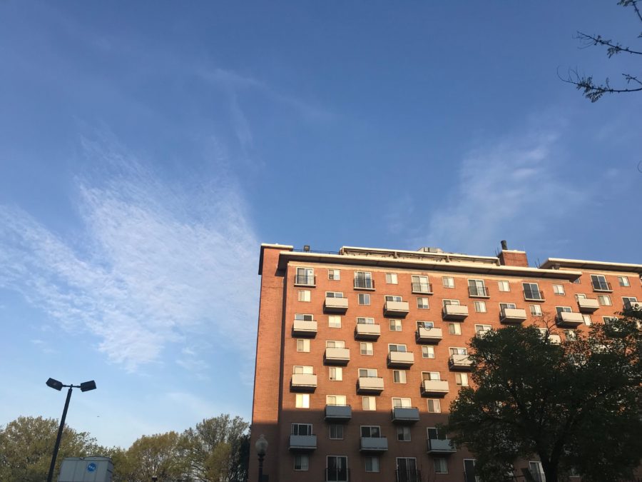 Photo showing the brick exterior of an apartment building.