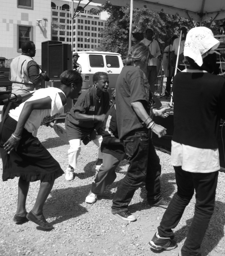 Photo of participants dancing in celebration.