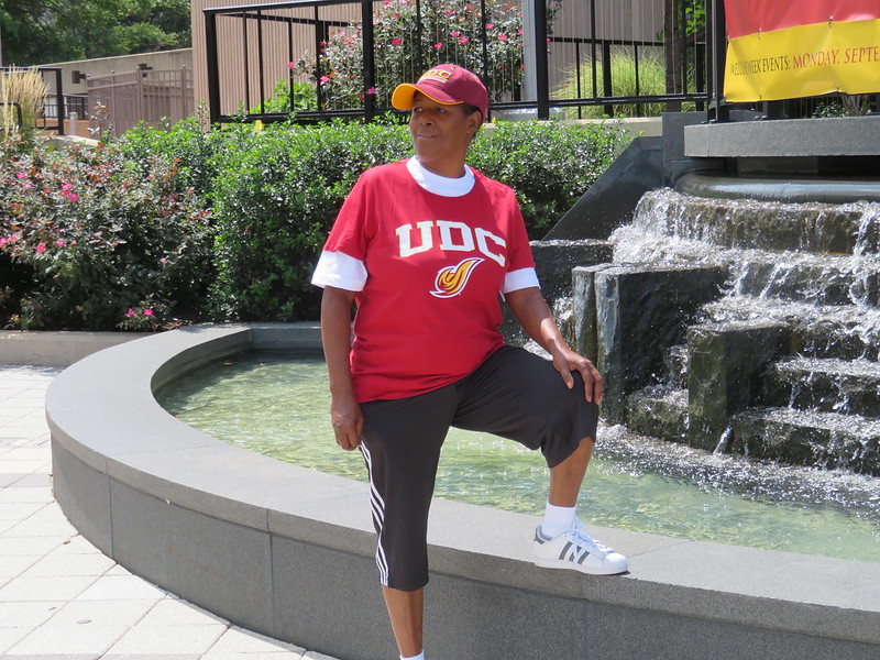 Photo of Street Sense artist and vendor Sheila White wearing her UDC gear.