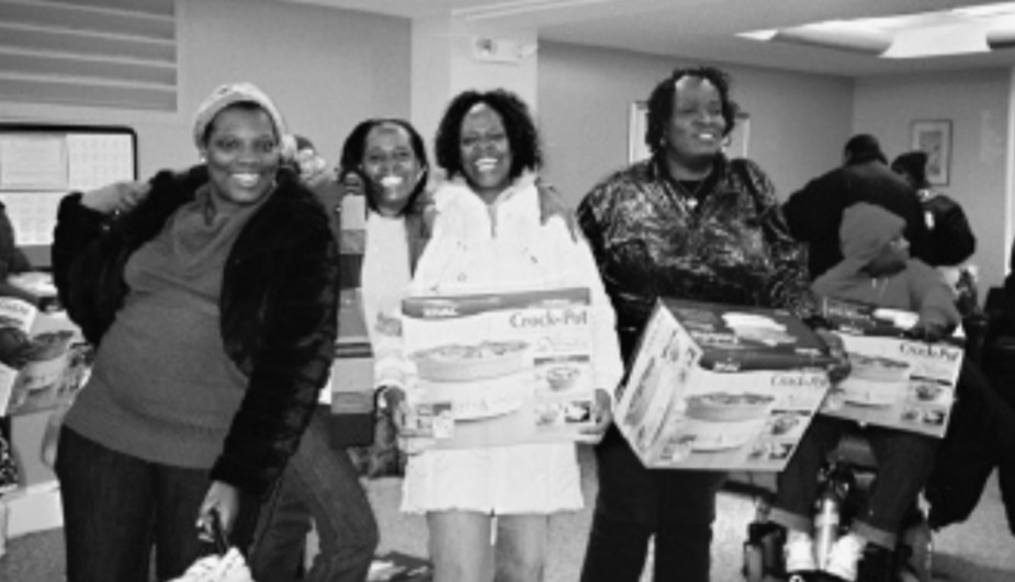 A photo of participants posing with their new Crock-Pots.