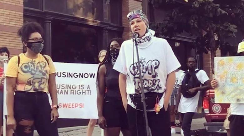 A photo of Bennetch speaking at a rally