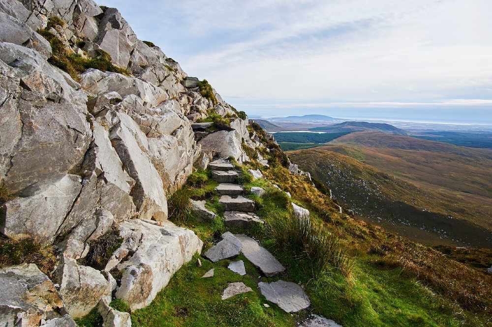 Photo of a view of a rocky nature trail in Ireland.