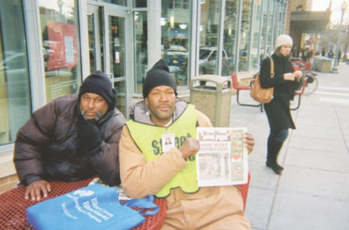 Shawn poses with a Street Sense Paper
