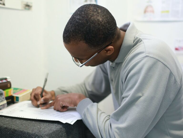 Photo of Joel Caston casting his ballot