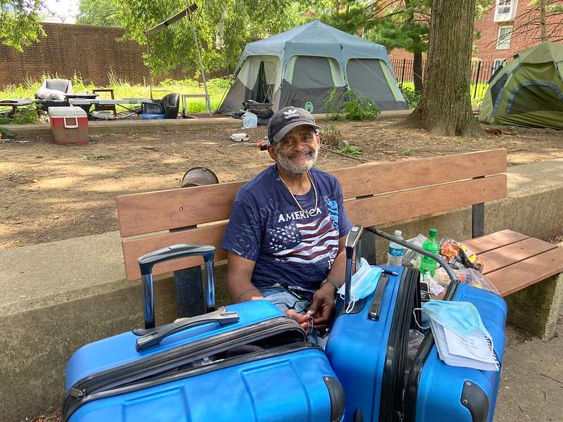Elliot Hardesty sits on a bench next to his belongings at the New Jersey Avenue and O Street NW Park.