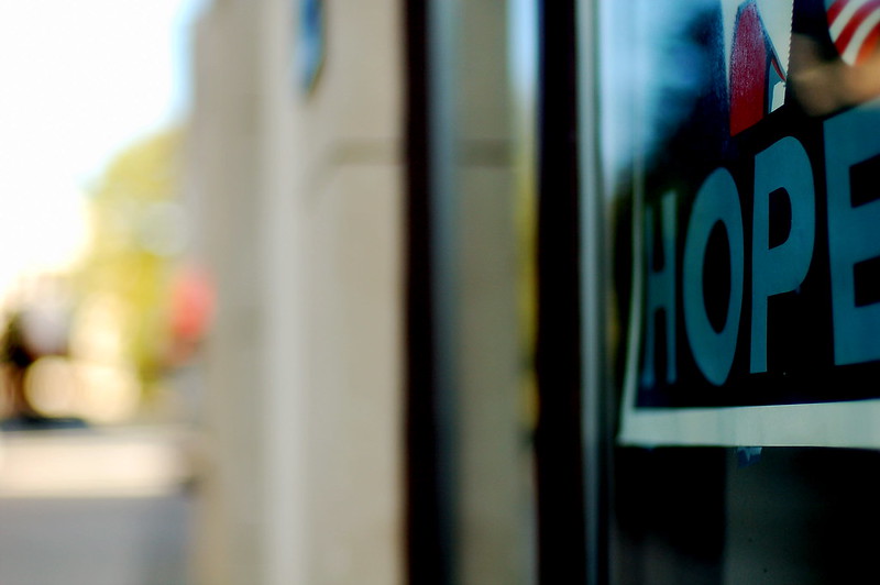 An unfocused photo with the bottom of an Obama "Hope" poster partially shown