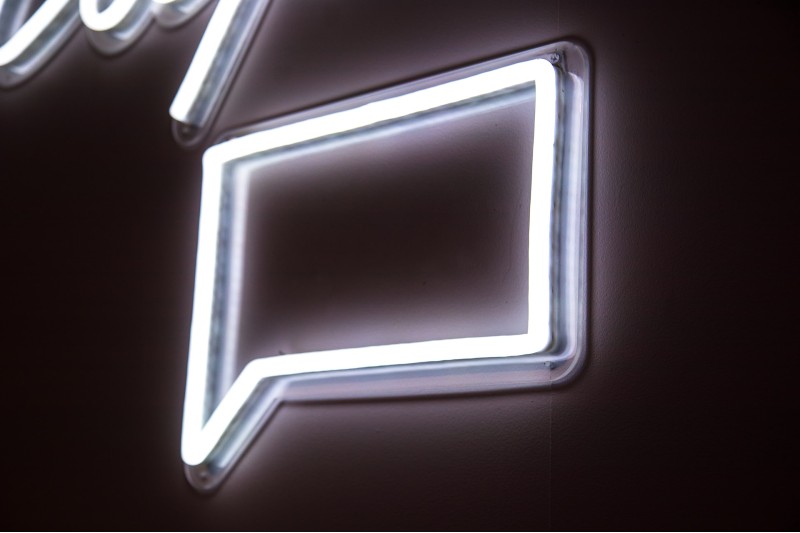 Photo of a neon light shaped like a conversation bubble