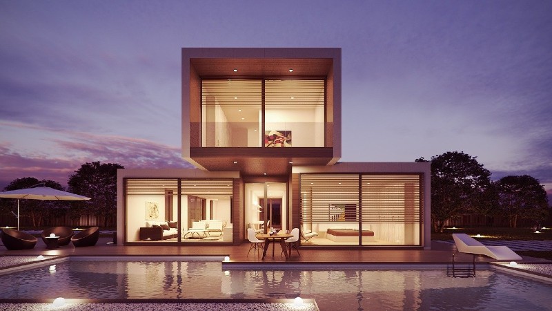 Photo of a luxury pool house and a swimming pool.