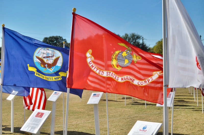 Photo of military flags waving in the wind