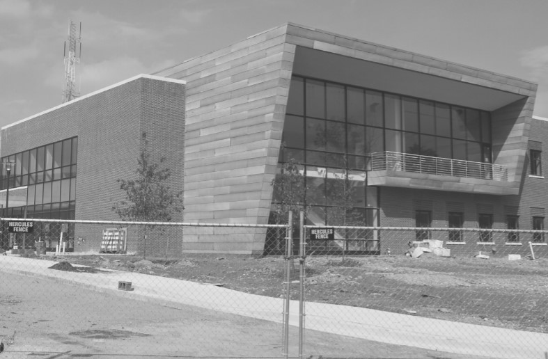 Photo of one of the new facilities, still walled off with temporary fencing