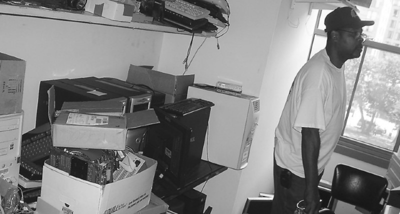 A candid photo of Meadows organizing computer equipment