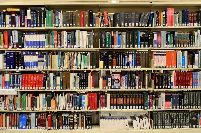 Photo of a row of books in a university library