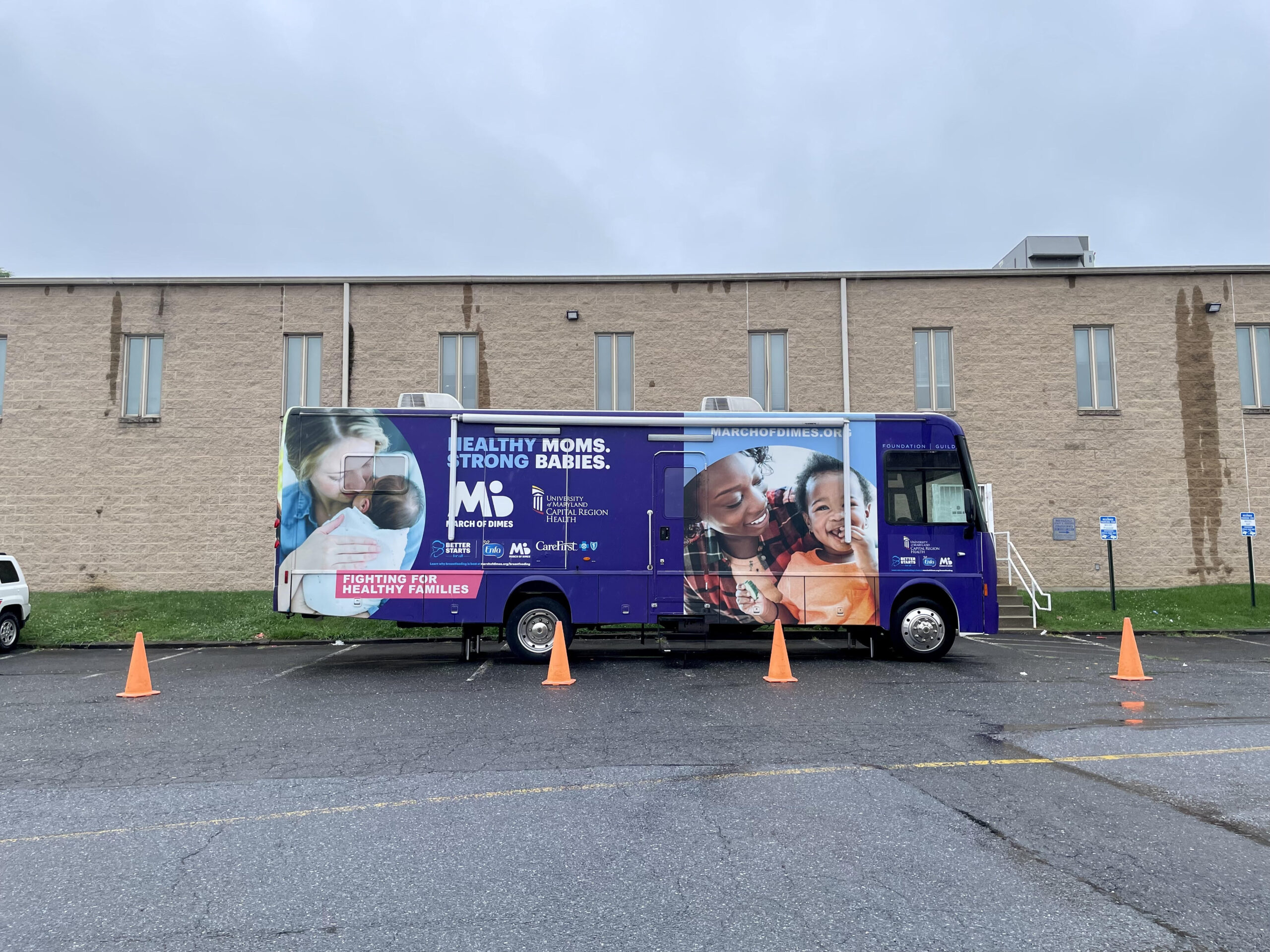 Photo of the "Mama and Baby Bus" parked in a parking lot.