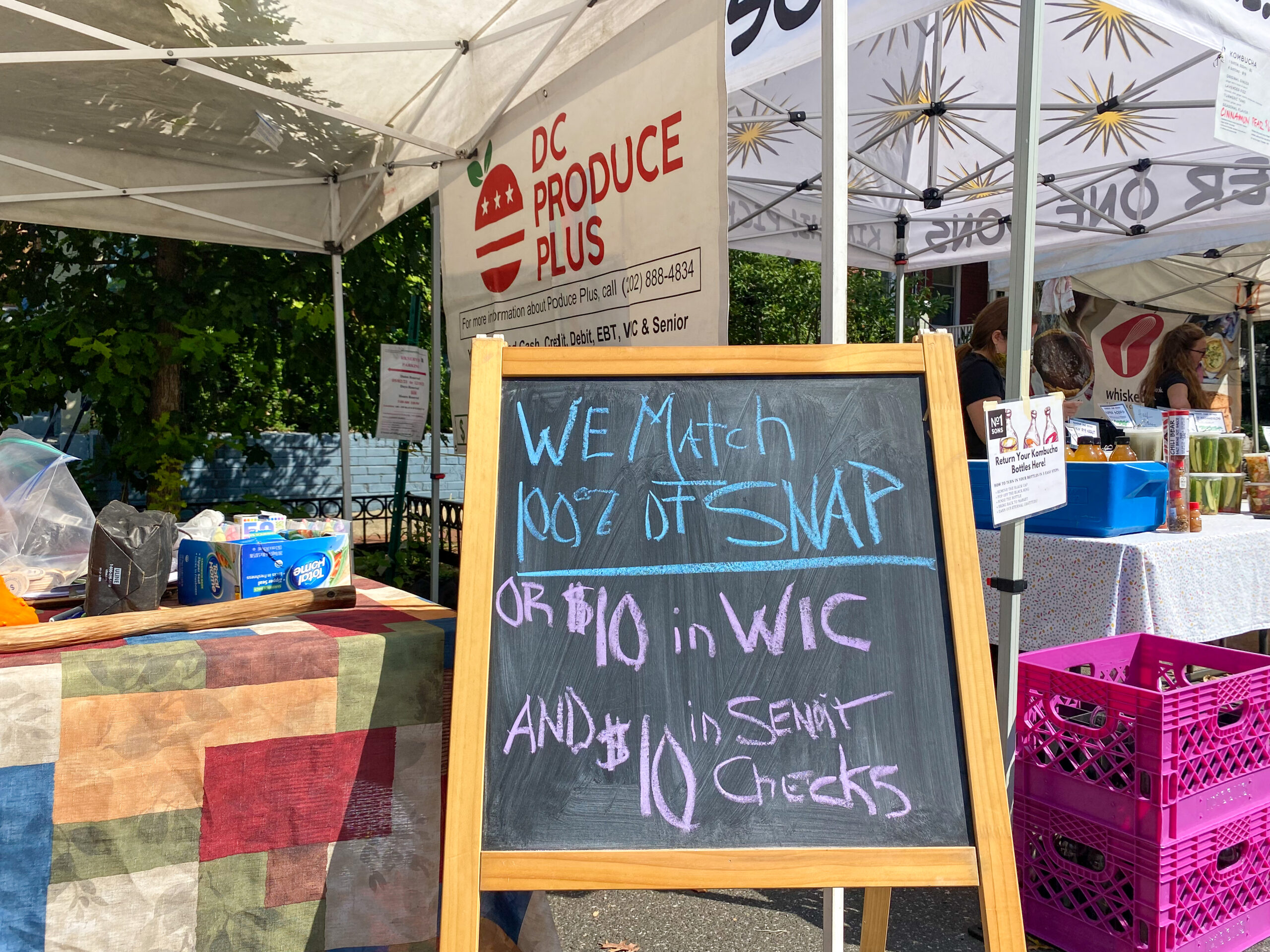Signage at the Bloomingdale Market shows what benefits are accepted, Sep. 19, 2021.