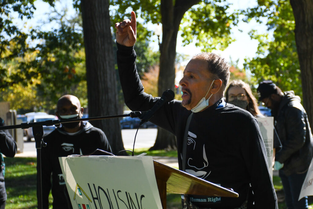Photo of protestor speaking in front of the U.S. Capitol