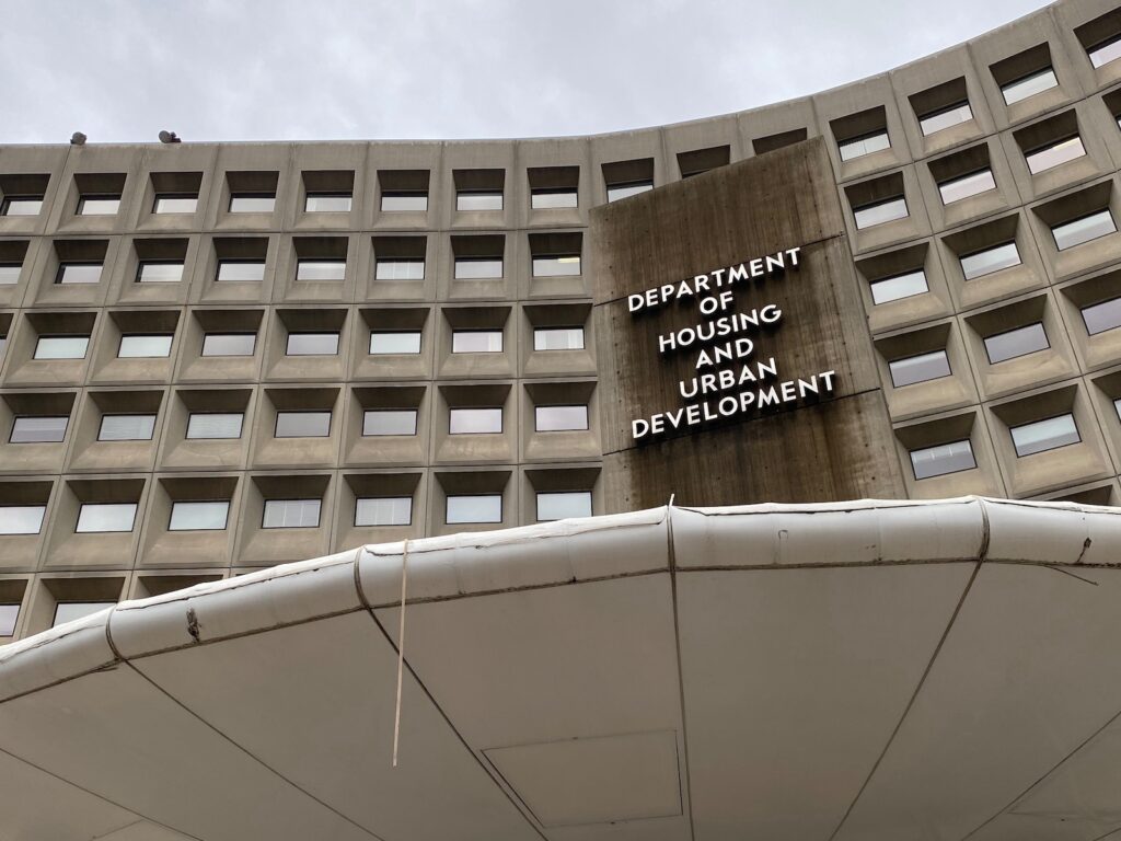 The U.S. Department of Housing and Urban Development, a large tan building with windows.