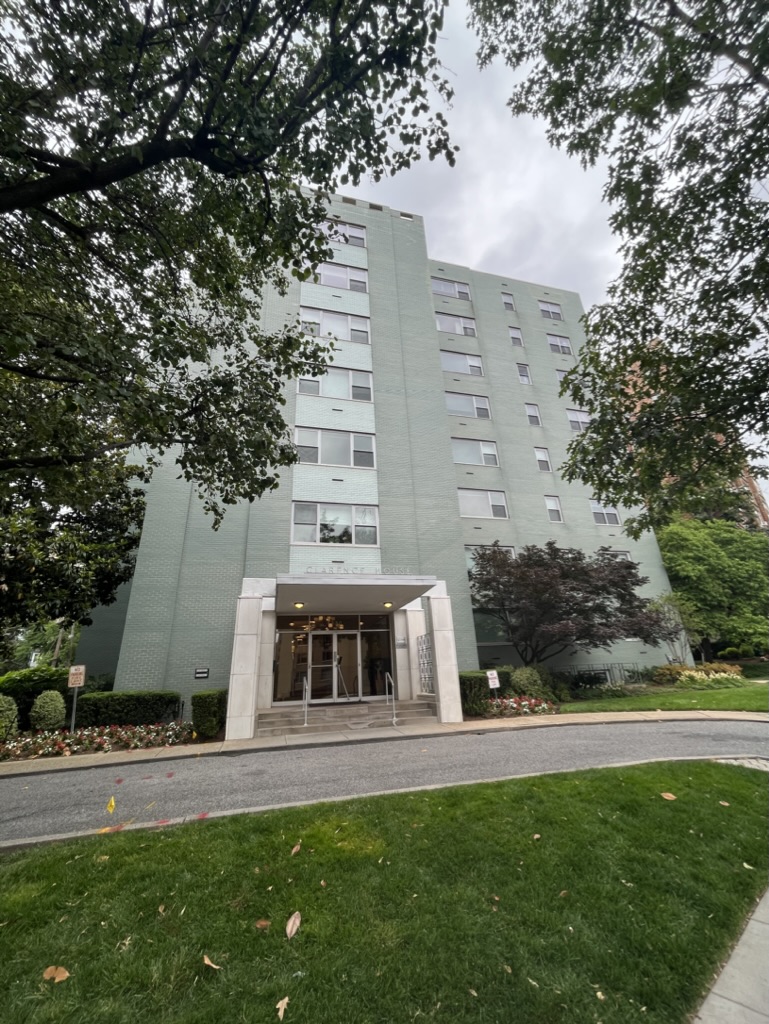 A green apartment building.