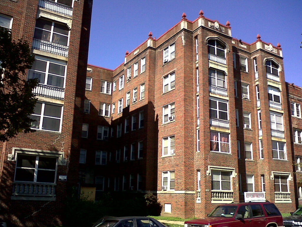 A tall brownstone apartment building