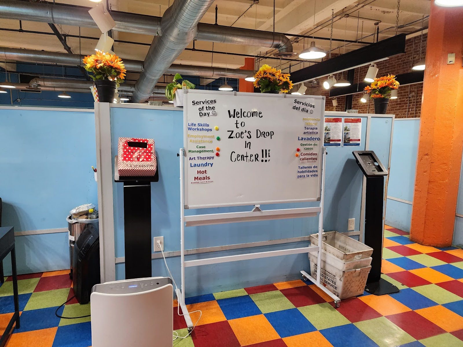 A whiteboard welcomes visitors to DC Doors.