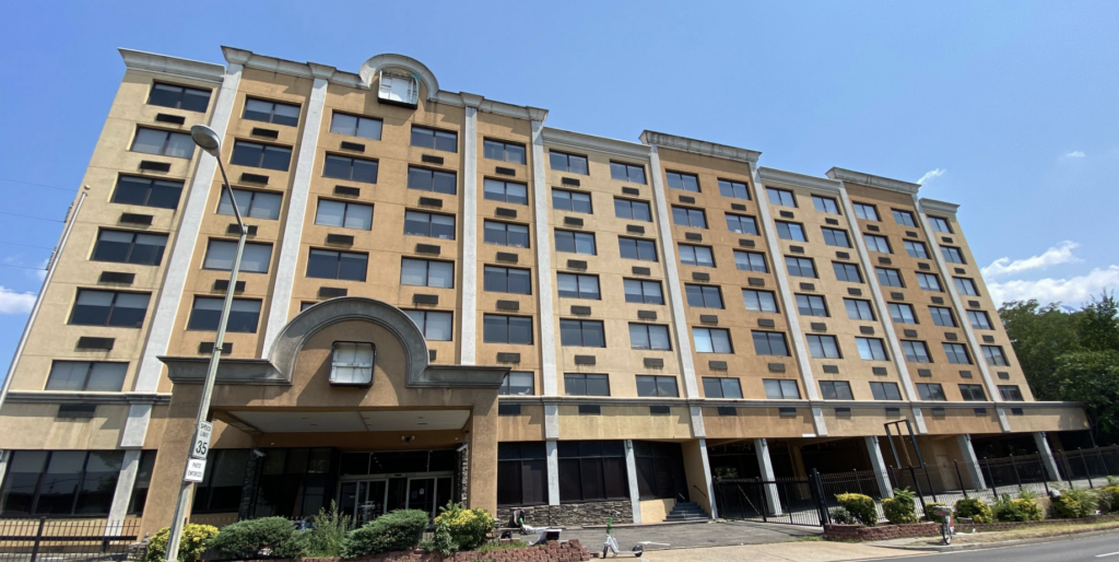 Tan building (Quality Inn Hotel)